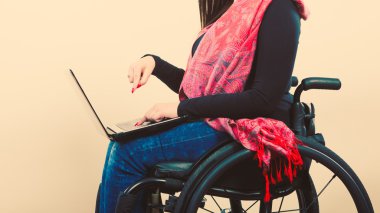 Crippled person with laptop  clipart