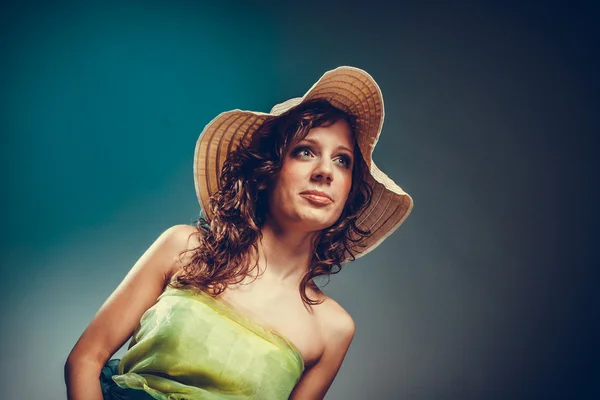 Young woman with green dress and hat. — Stock Photo, Image