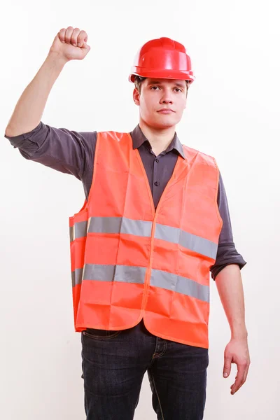 Arbeiter in orangefarbener Uniform mit erhobener Hand. — Stockfoto