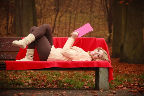 Blonde girl with red book. — Stock Photo, Image