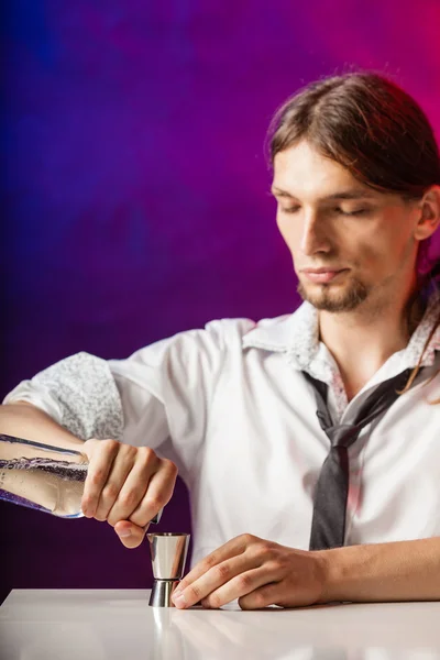 Barman fills shot glass. — Stock Photo, Image