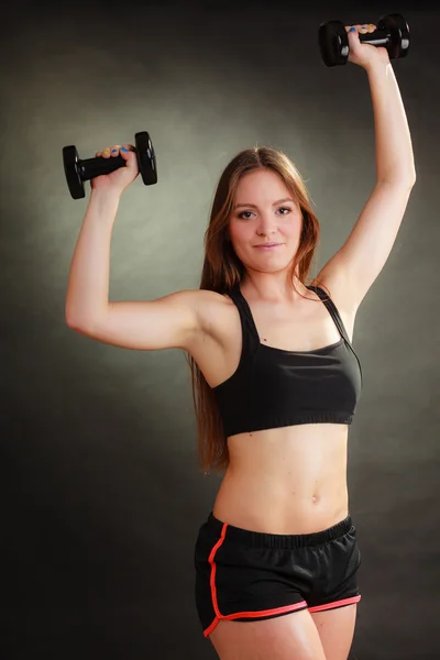 Fit woman exercising with dumbbells. — Stock Photo, Image