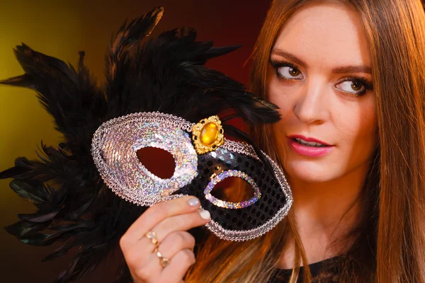 Woman holds carnival mask closeup — Stock Photo, Image