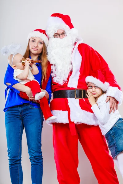 Happy family together with Santa Claus. — Stock Photo, Image