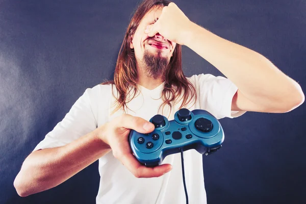 Unhappy male playing games — Stock Photo, Image