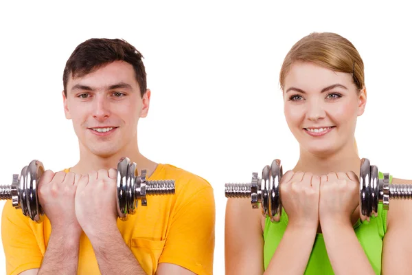 Couple exercising with dumbbells lifting weights — Stock Photo, Image