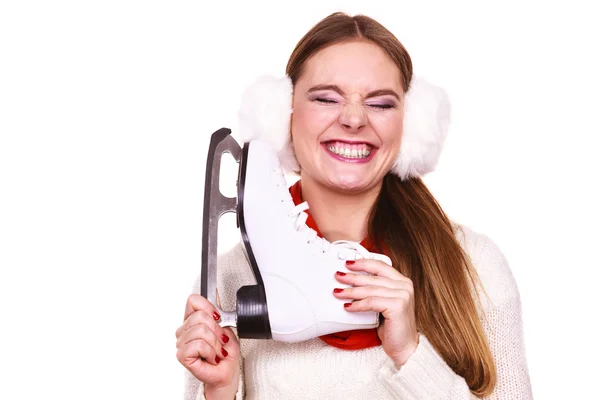 Woman with earmuffs and ice skates. — Stock Photo, Image