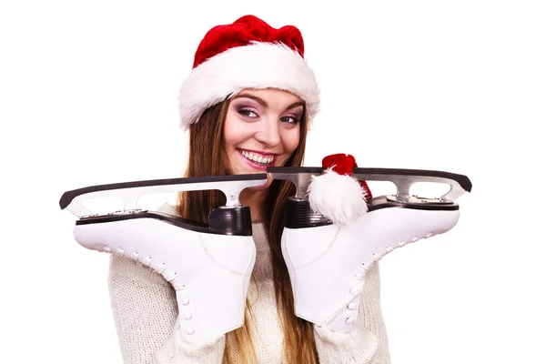 Woman santa claus with ice skates — Stock Photo, Image