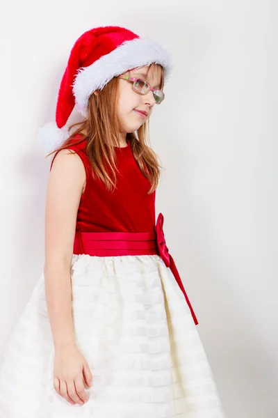 Meisje kijkt op santa elf. — Stockfoto