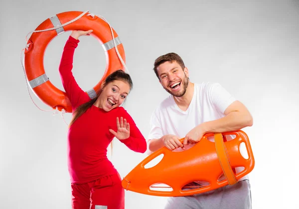 Lifeguard couple with rescue equipment — Stock Photo, Image