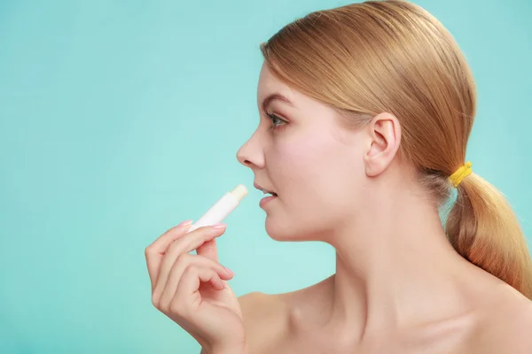 Woman applying balsam for lips — Stock Photo, Image