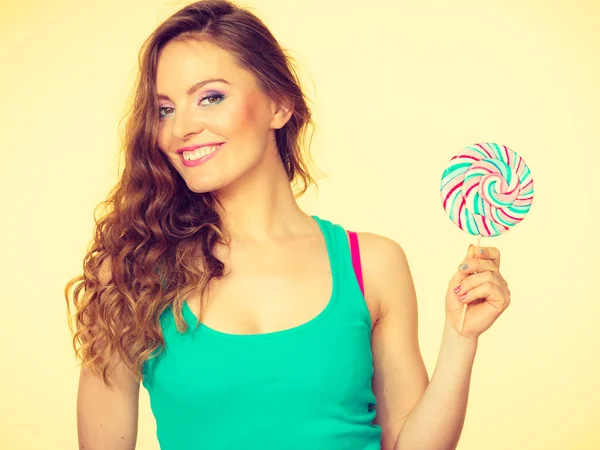 Woman charming girl with lollipop candy — Stock Photo, Image