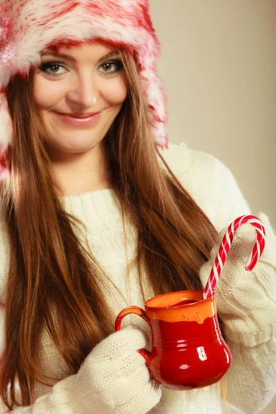 Girl with cane in xmas mug. — Stock Photo, Image