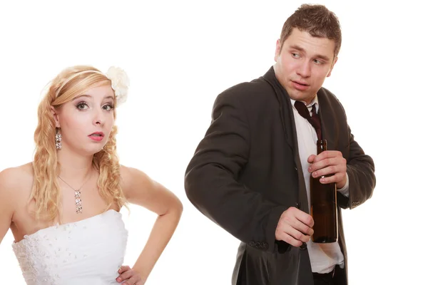 Wedding couple, bride with alcoholic drinking groom. — Stock Photo, Image