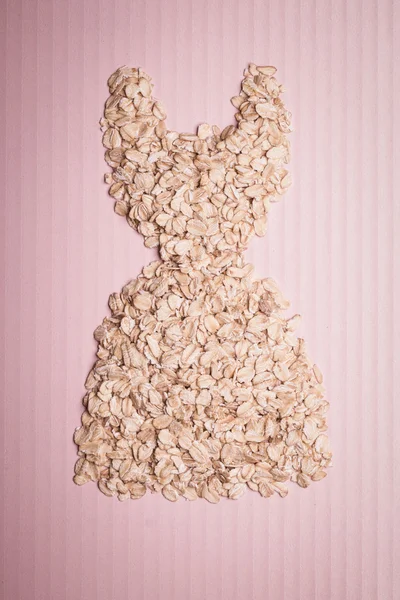 Dress shape made from oatmeal — Stock Photo, Image