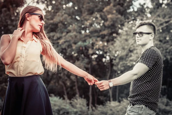 Cheerful girl holding hands in park. — Stock Photo, Image