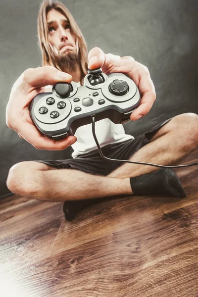 Unhappy male playing games — Stock Photo, Image