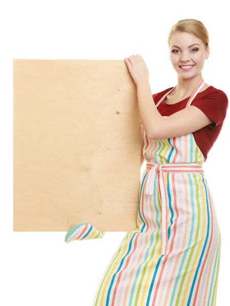 Housewife holds wooden board with copy space — Stock Photo, Image