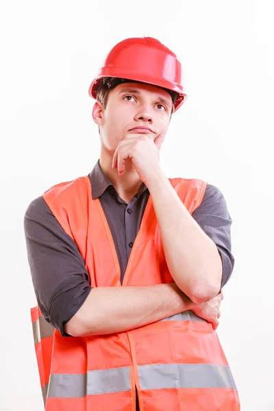 Arbeiter in orangefarbener Uniform und Helm. — Stockfoto