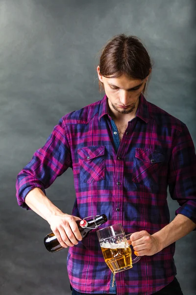 Tapster fills stein from bottle. — Stock Photo, Image