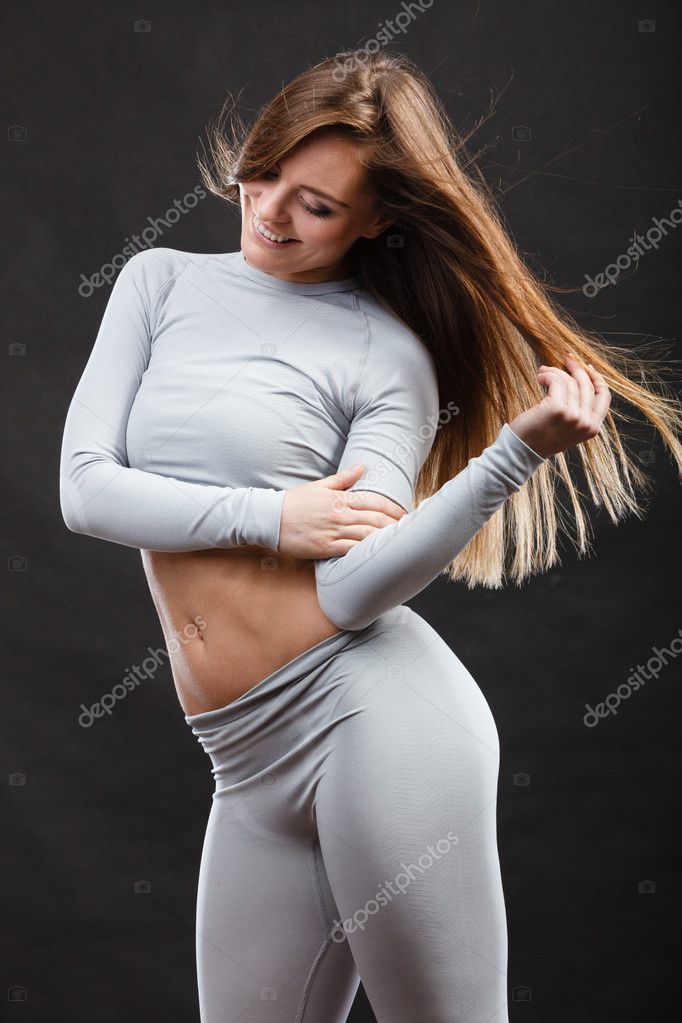 Sport fit woman in thermal clothes. Stock Photo by ©Voyagerix 128291904