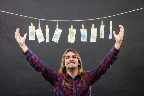 Rich man with laundry of money — Stock Photo, Image