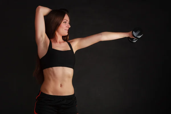 Fit woman exercising with dumbbells. — Stock Photo, Image