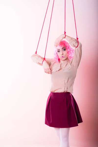 Woman girl stylized like marionette puppet on string — Stock Photo, Image