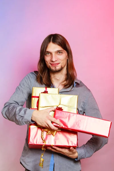 Guy with many presents gift boxes — Stock Photo, Image