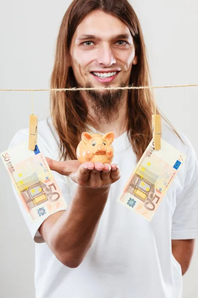 Man holding moneybox piggybank — Stock Photo, Image