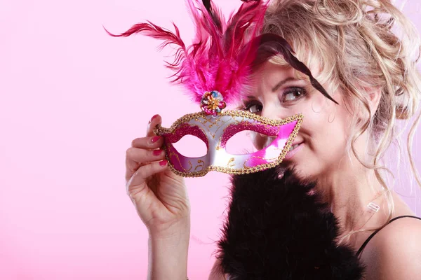 Woman middle aged holds carnival mask. — Stock Photo, Image