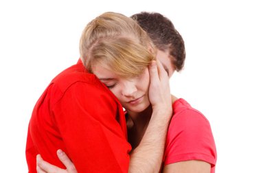 Couple. Woman is sad and being consoled by his partner  clipart