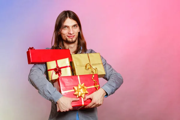 Guy with many presents gift boxes — Stock Photo, Image