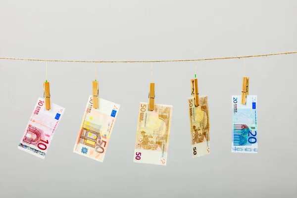 Banknotes on laundry line — Stock Photo, Image