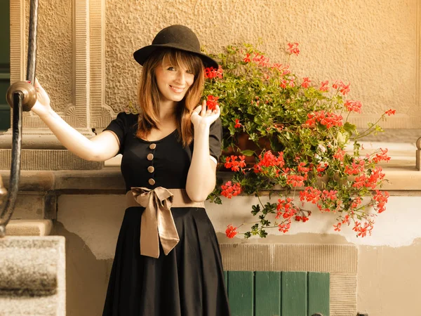 Retro style fashion woman in old town — Stock Photo, Image