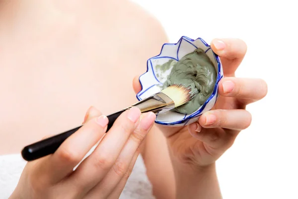 Skin care. Closeup of brush and clay mud mask. — Stock Photo, Image