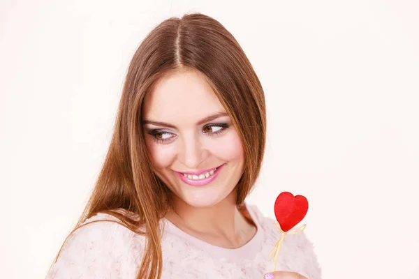 Beautiful woman holding heart shaped hand stick — Stock Photo, Image