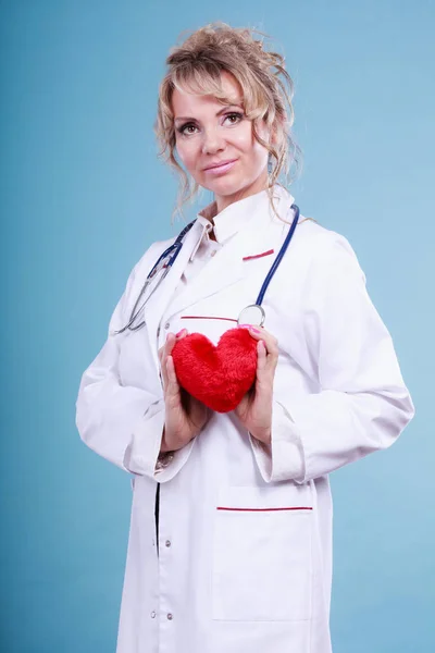 Middle aged blonde doctor enjoy her work. — Stock Photo, Image