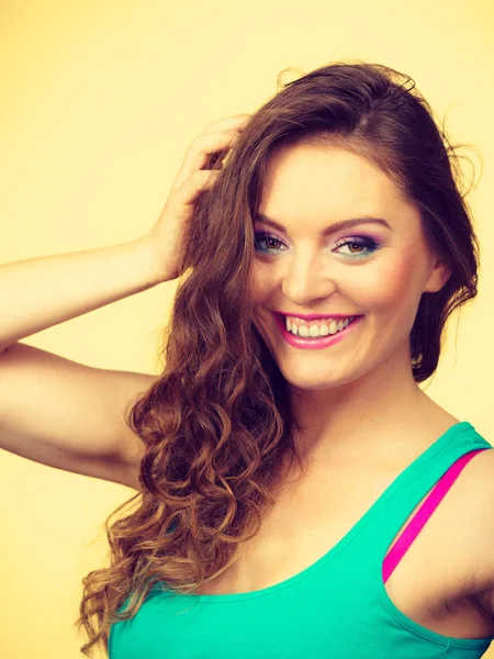 Portrait, young woman wearing colorful makeup and blue top — Stock Photo, Image
