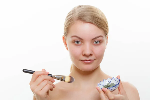 Woman mixing face mask in little porcelain bowl — Stock Photo, Image