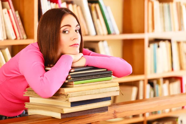 Tired girl student in college library — Stock Photo, Image