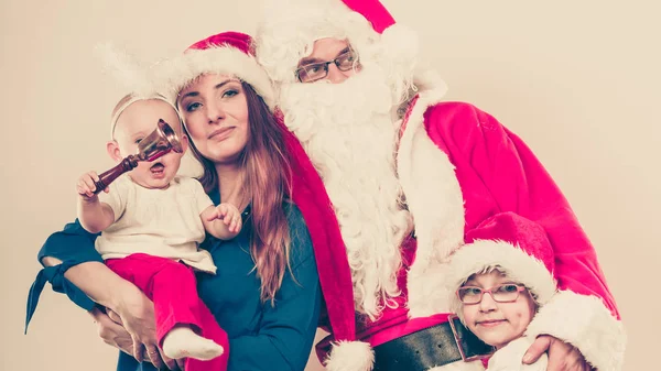 Happy family together with Santa Claus. — Stock Photo, Image