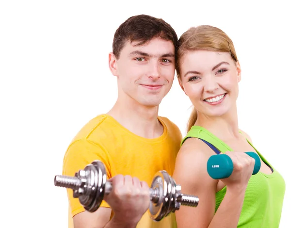 Couple exercising with dumbbells lifting weights — Stock Photo, Image