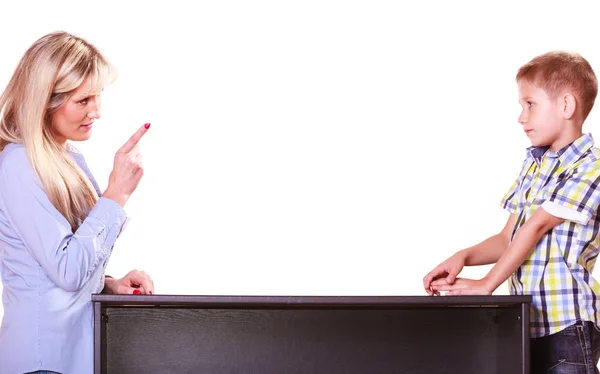 Mother and son talk and argue sit at table. — Stock Photo, Image