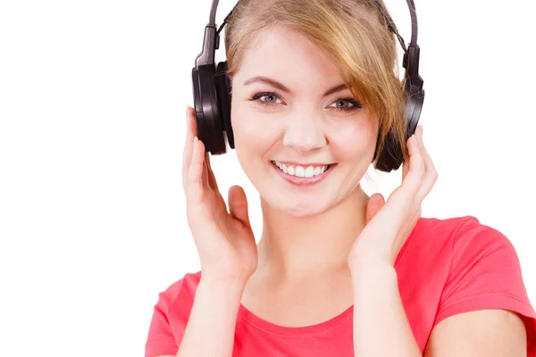 Woman in big headphones listening music isolated — Stock Photo, Image