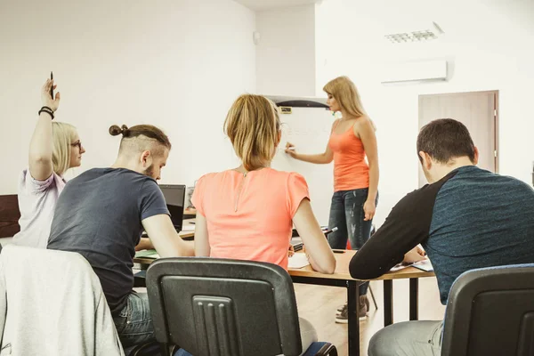 Students in classroom learning english