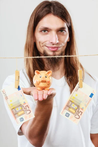 Man holding moneybox piggybank — Stock Photo, Image