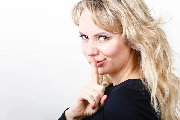 Blondie woman with silence gesture — Stock Photo, Image