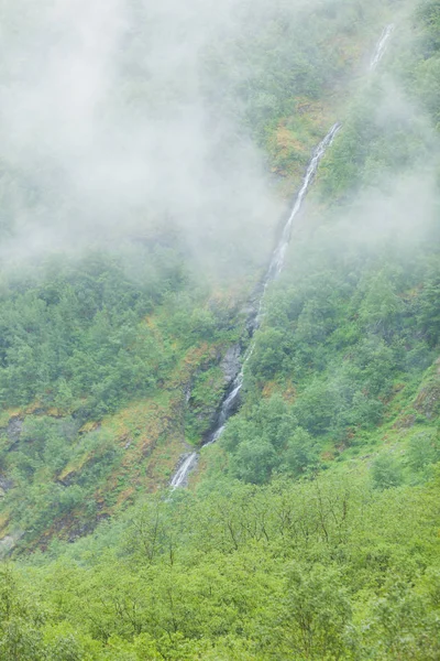 Waterfall in mountains foggy day, Norway. — Stock Photo, Image