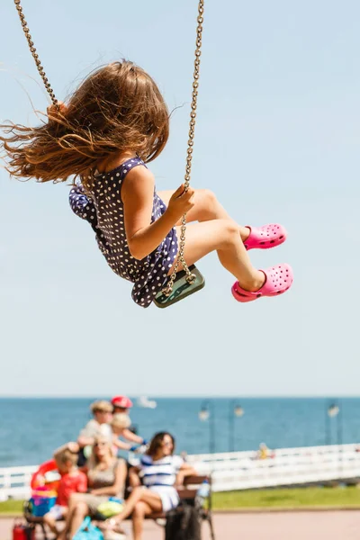 Playful crazy girl on swing. — Stock Photo, Image